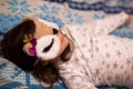 Cute kid girl sleeping in an owl sleep mask Royalty Free Stock Photo