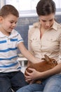 Cute kid and mum with pet bunny Royalty Free Stock Photo