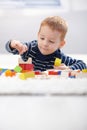 Cute kid playing on floor at home Royalty Free Stock Photo