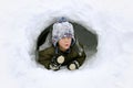 Cute Kid Playing Outside in Winter Snow Fort