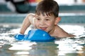 Cute kid playing at swimming pool Royalty Free Stock Photo