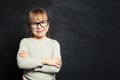 Cute kid portrait. Happy child girl smiling and looking at camera on school classroom background Royalty Free Stock Photo