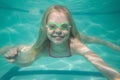 Cute kid posing underwater in pool