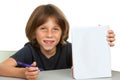 Cute kid showing notebook with blank copy space.