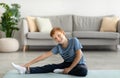 Cute kid stretching on fitness mat at home Royalty Free Stock Photo