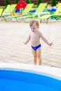 Cute kid by the swimming pool Royalty Free Stock Photo