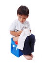 Cute kid with toilet paper on toilet Royalty Free Stock Photo