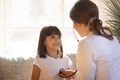 Cute kid visiting female doctor pediatrician holding stethoscope examining child Royalty Free Stock Photo