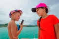 Cute kids on a boat trip. Boy is playing a toy guitar and sings Royalty Free Stock Photo