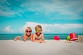 Cute kids -boy and girls- play with toys and sand on beach Royalty Free Stock Photo