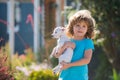 Cute kids boy hugging dog, hug friends. Royalty Free Stock Photo