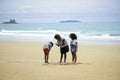 Cute kids having fun together on sandy summer beach with blue sea, happy childhood girls friend playing on tropical beach Royalty Free Stock Photo