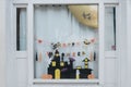 Cute kids paper crafts display at nursery house's window for celebrating on October 31, Halloween day.