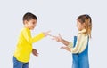 Cute kids play stone, paper scissors and have fun on a white background.