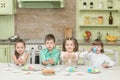 Cute kids playing Easter eggs at the table and laugh Royalty Free Stock Photo