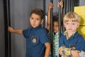 Cute kids playing police in childrens center.