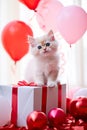 Cute kitten with a red balloons and a gift box. Birthday greeting card. Promotional banner for animal shelter, pet shop Royalty Free Stock Photo