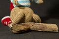Cute knitted toy bunny with small driftwood - perfect for easter decorations