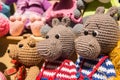 Cute knitted toys knitted Hippo sit together with other crochet toys in the weekend market.