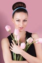 Cute lady with bouquet pink tulips Royalty Free Stock Photo