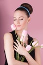 Cute lady with bouquet pink tulips Royalty Free Stock Photo