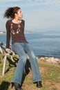 Cute lady in casual clothes on sea side