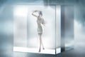 Cute lady imprisoned in a glass cube