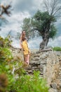 Cute lady posing among antique ruins Royalty Free Stock Photo