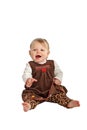 Cute laughing baby in brown velvet dress Royalty Free Stock Photo