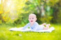 Cute laughing baby in the sunny garden Royalty Free Stock Photo