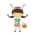 Cute laughing girl with bunny ears stands and holds big ornate egg and basket with eggs.