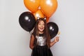 Cute laughing girl with candy and balloons Royalty Free Stock Photo