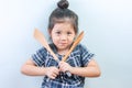 Cute Lilte Asian Thai Girl Poses with cooking equipment on white