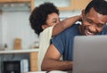 Cute little African American boy hugging and playing with dad while his dad working from home with laptop computer for remoter job Royalty Free Stock Photo