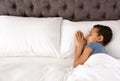 Cute little African-American boy sleeping in bed Royalty Free Stock Photo