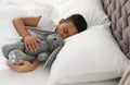 Cute little African-American boy with toy rabbit sleeping Royalty Free Stock Photo