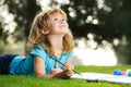 Cute little artist boy. Kids painting with paints color and brush in park outdoor. Royalty Free Stock Photo