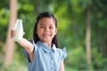 Cute little asia girl is drinking milk in bottle Royalty Free Stock Photo