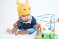 Cute little asian baby boy sitting and play toy Royalty Free Stock Photo