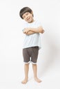 Cute little Asian boy with happy face, he laughing smiles and looking to camera on white background. Royalty Free Stock Photo