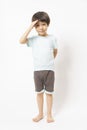 Cute little Asian boy with happy face, he laughing smiles and looking to camera on white background. Royalty Free Stock Photo