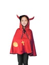 Cute little Asian child girl dressed Halloween costume. Kid in Dracula robe isolated on white background