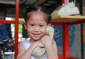 Cute little asian child girl talking on the retro telephone Royalty Free Stock Photo