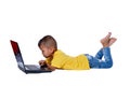 Cute little Asian girl child lying on the floor studying or using laptop isolated on white background Royalty Free Stock Photo