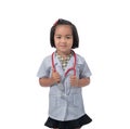 Cute Little asian girl doctor smiling and holding stethoscope while wearing Doctor`s uniform Royalty Free Stock Photo