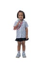 Cute Little asian girl doctor smiling and holding stethoscope while wearing Doctor`s uniform Royalty Free Stock Photo