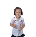 Cute Little asian girl doctor smiling and holding stethoscope while wearing Doctor`s uniform Royalty Free Stock Photo
