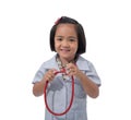 Cute Little asian girl doctor smiling and holding stethoscope while wearing Doctor`s uniform Royalty Free Stock Photo