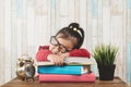 Cute little asian girl fall asleep while studying Royalty Free Stock Photo