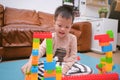 Cute little Asian kindergarten boy playing blocks with colorful plastic blocks indoor at home, Educational toys for young children Royalty Free Stock Photo